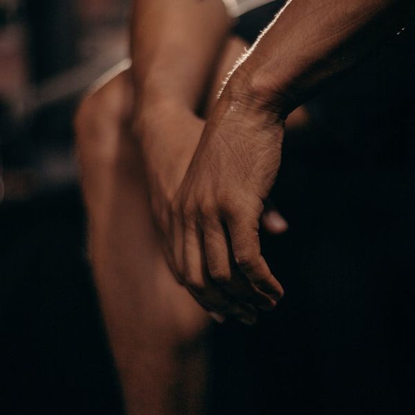 Close-up of a man's hands in a strong grip position.