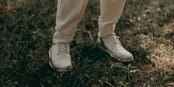 Low angle shot of feet firmly planted on the ground.